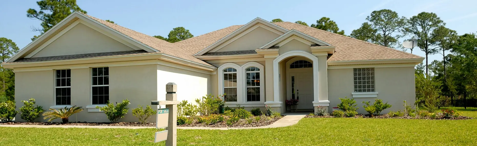Front view of a single-family home in San Bernardino being sold before the owner’s relocation.